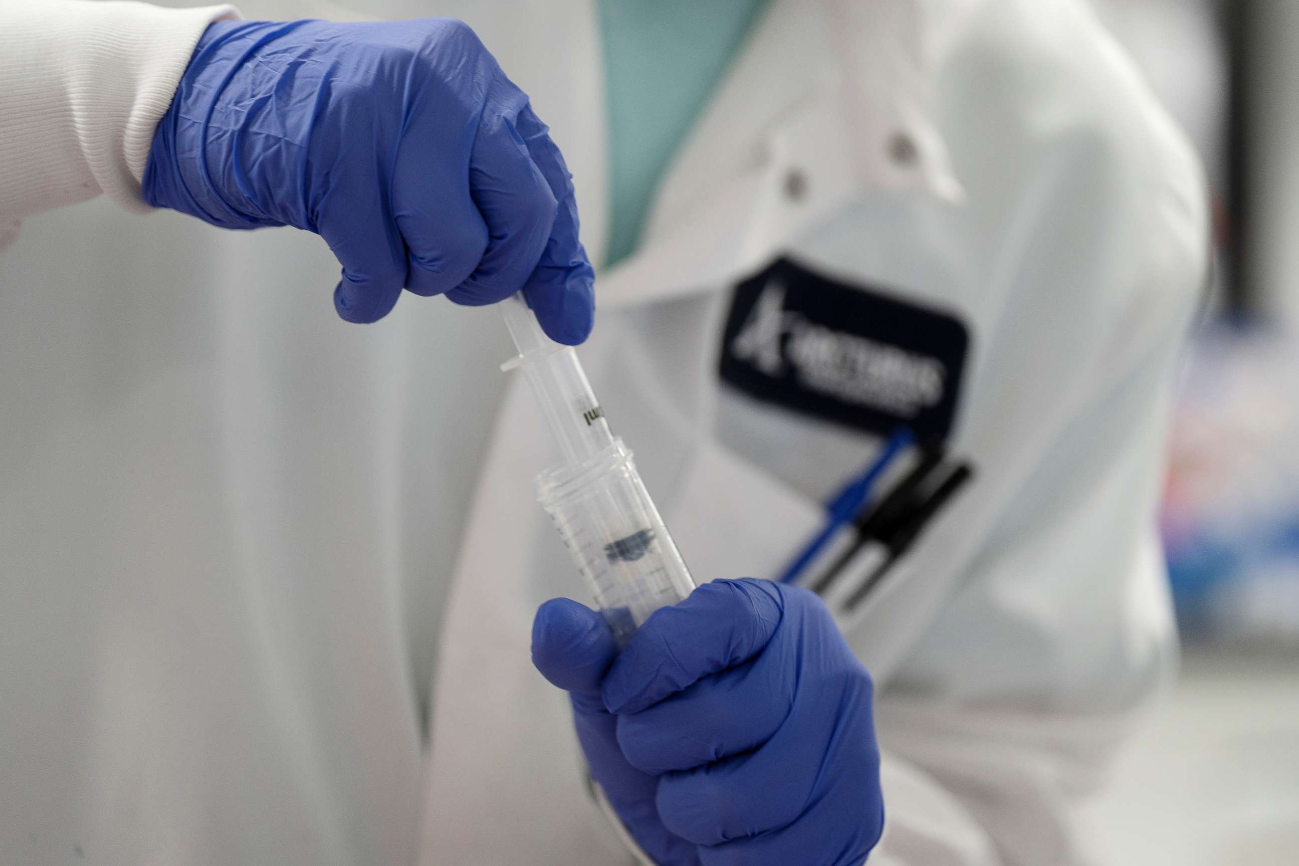 FILE PHOTO: A scientist conducts research on a vaccine for the novel coronavirus (COVID-19) at the laboratories of RNA medicines company Arcturus Therapeutics in San Diego, California, U.S., March 17, 2020.