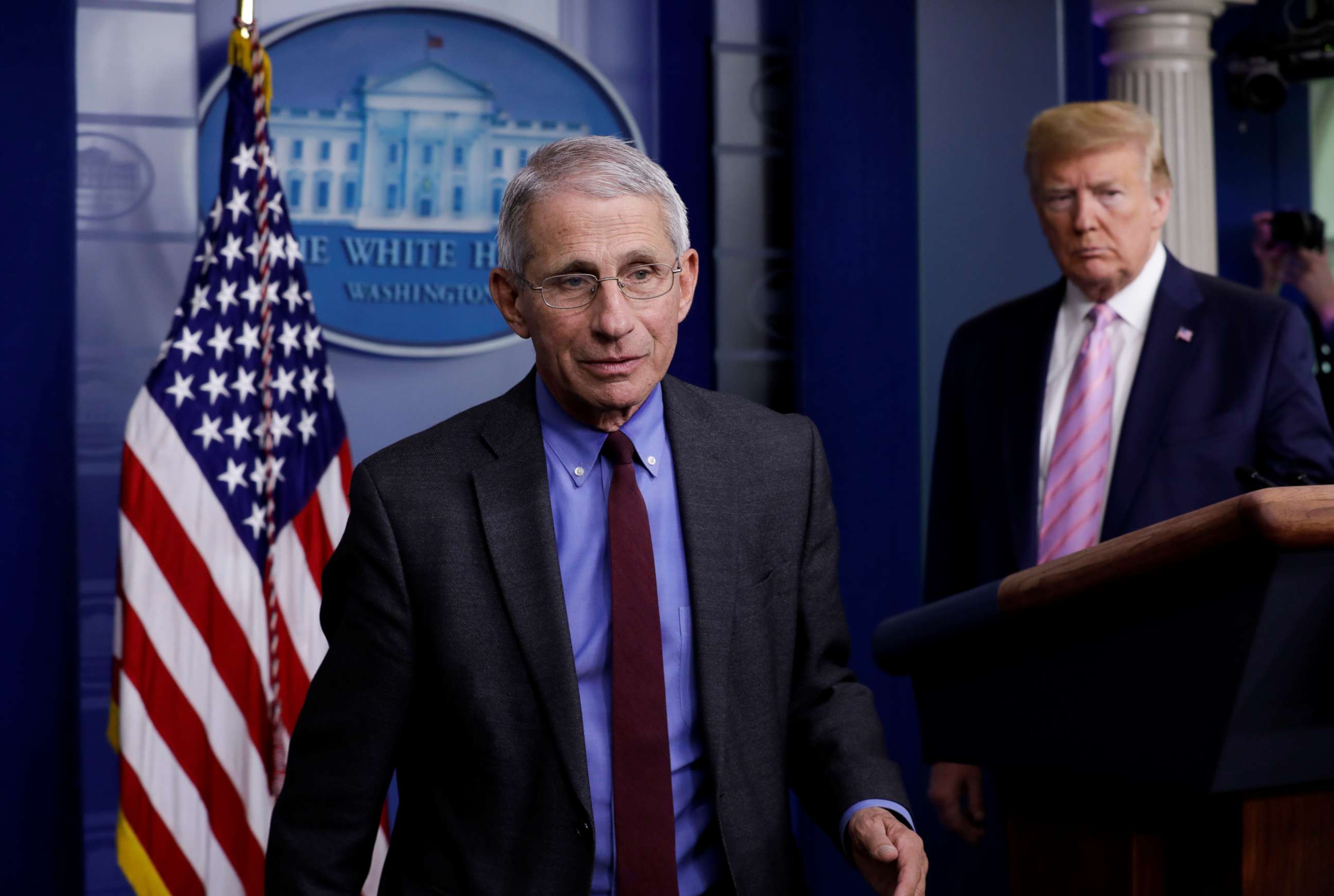 PHOTO: National Institute of Allergy and Infectious Diseases director Dr. Anthony Fauci turns the podium over to U.S. President Donald Trump during the coronavirus response daily briefing at the White House in Washington, U.S., April 10, 2020. 
