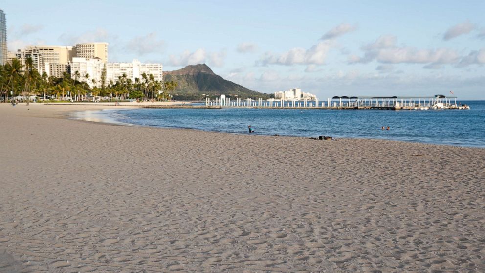 FILE PHOTO: Waikiki Beach is nearly empty due to the business downturn caused by the coronavirus disease (COVID-19) in Honolulu, Hawaii, U.S. April 28, 2020. Picture taken April 28, 2020.