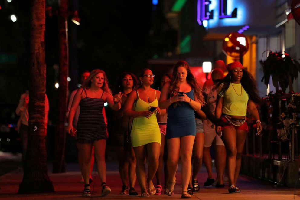 PHOTO: University students walk along a street of Miami Beach during Spring Break after local authorities closed restaurants, bars, gyms, movie theaters and other similar businessesdue to coronavirus disease in Miami Beach, Florida, U.S., March 18, 2020. 
