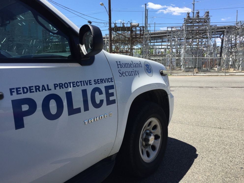 PHOTO: A Department of Homeland Security vehicle is parked near an electric company's equipment. 