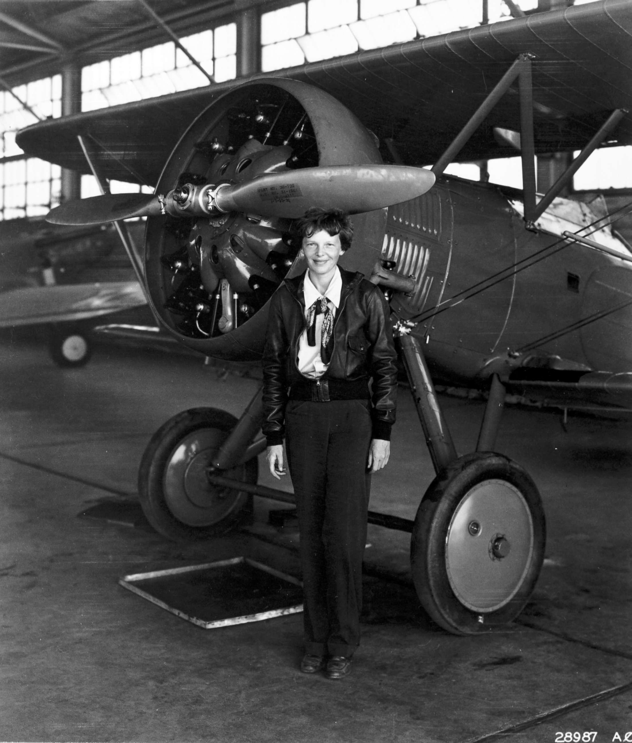 PHOTO: Amelia Earhart poses in front of a plane. HISTORY is airing the two-hour special "Amelia Earhart: The Lost Evidence" on July 9, 2017, unveiling original documents and new information about the fate of the aviator. 
