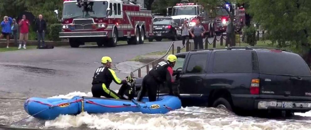 Firefighters Rescue Woman From SUV Stuck In Rising Floodwaters - ABC News