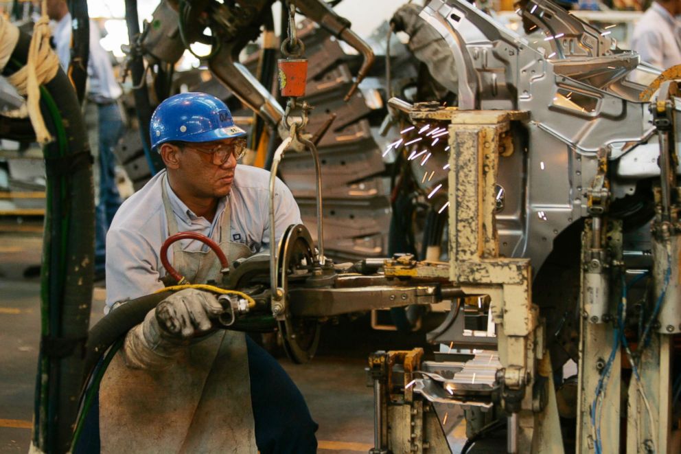 PHOTO: Workers on the assembly line at the General Motors assembly plant in Valencia, Venezuela in this March 16, 2007.