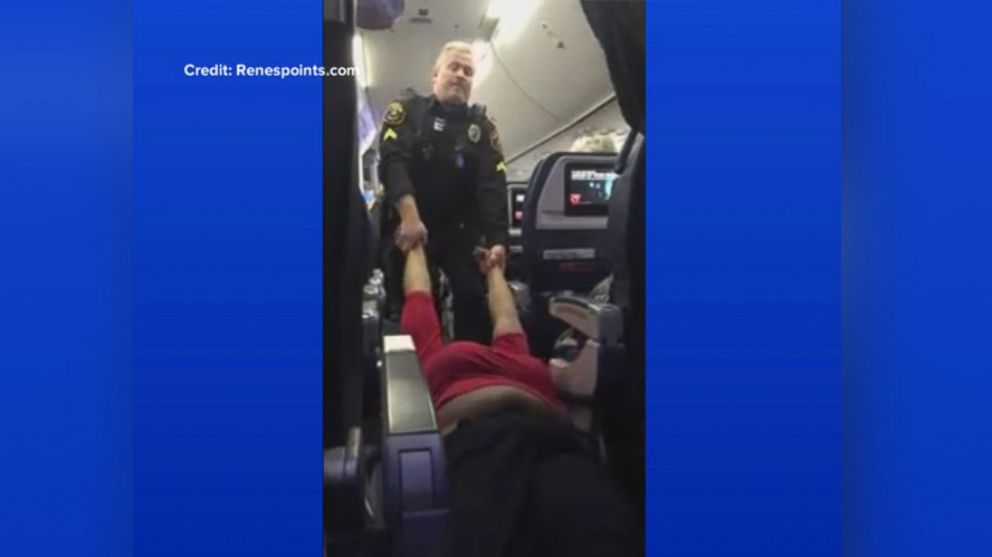 PHOTO: An airport police officer drags a woman by her arms off a plane in San Diego, California, Dec. 12, 2016.