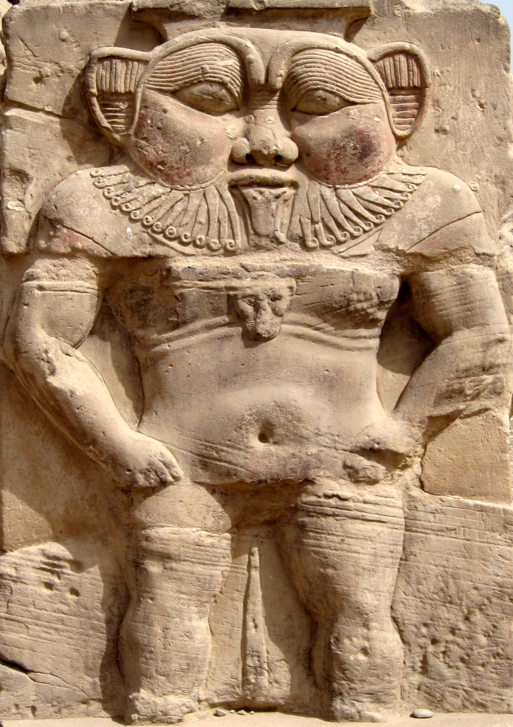 PHOTO: Relief of the god Bes next to the Roman north gate of the temple complex of Dendera, Egypt.