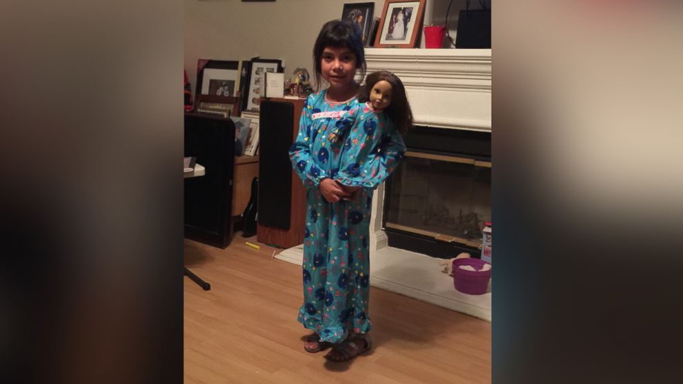 PHOTO: Adrianna Escamilla holds her beloved doll, Katy, prior to leaving the doll behind at a local Home Depot store.