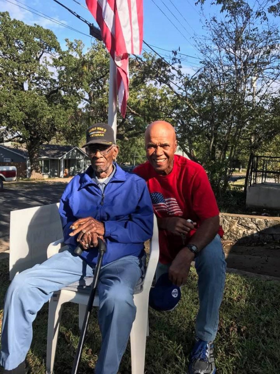 Volma Overton Jr., right, is pictured with Richard Overton, a World War II veteran who has lived in his Austin, Texas, home since the 1940s.