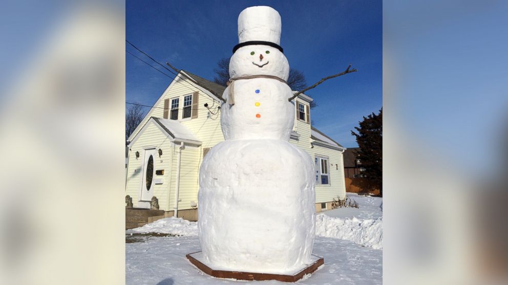 A father in Providence, Rhode Island built a 16-foot-tall snowman as a labor of love for his two daughters. 
