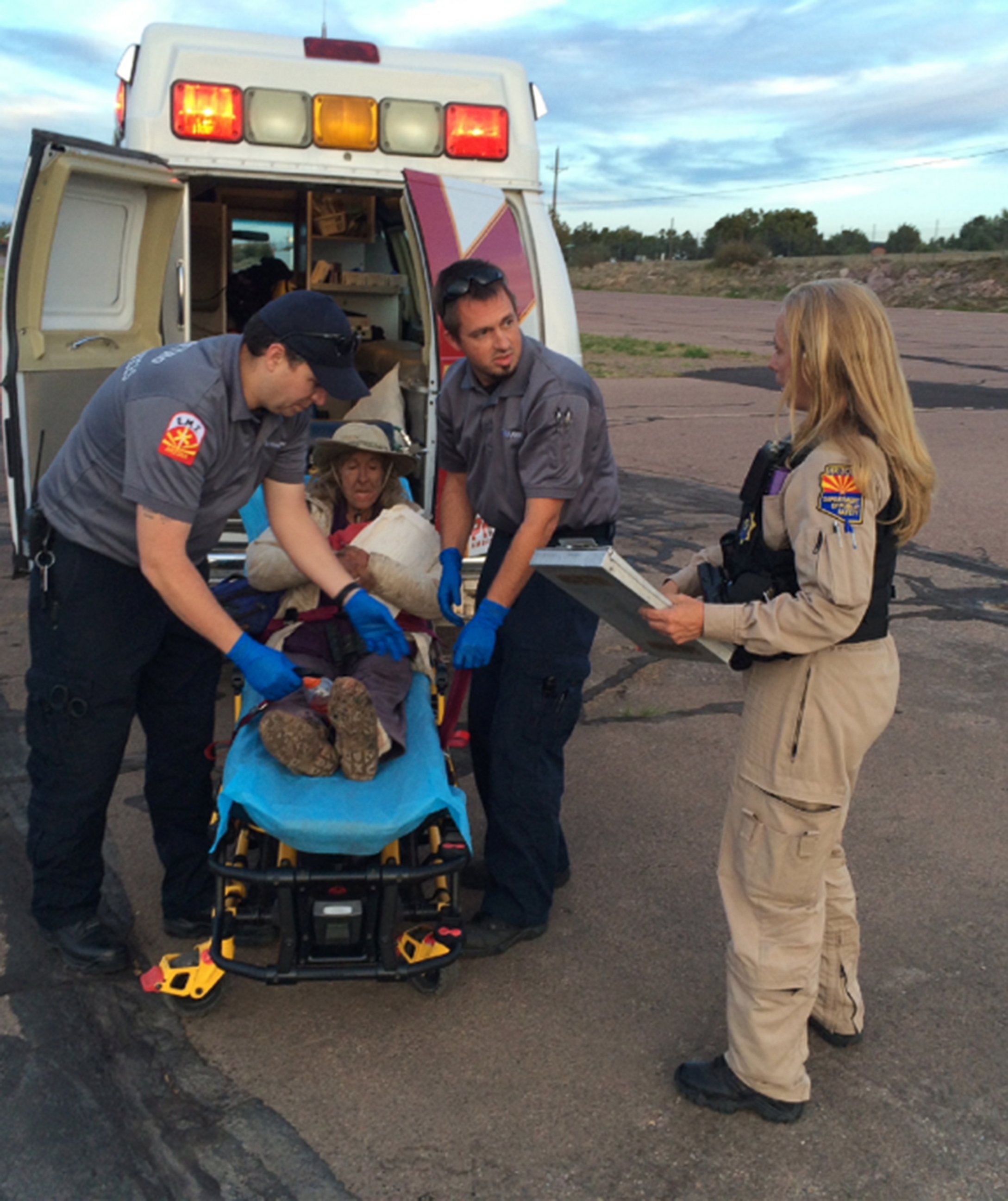PHOTO: Members of the Arizona Dept. of Public Safety Air Rescue Unit tend to 72-year-old Ann Rodgers who went missing March 31st in the area of Canyon Creek on the White River Indian Reservation in Gila County. 