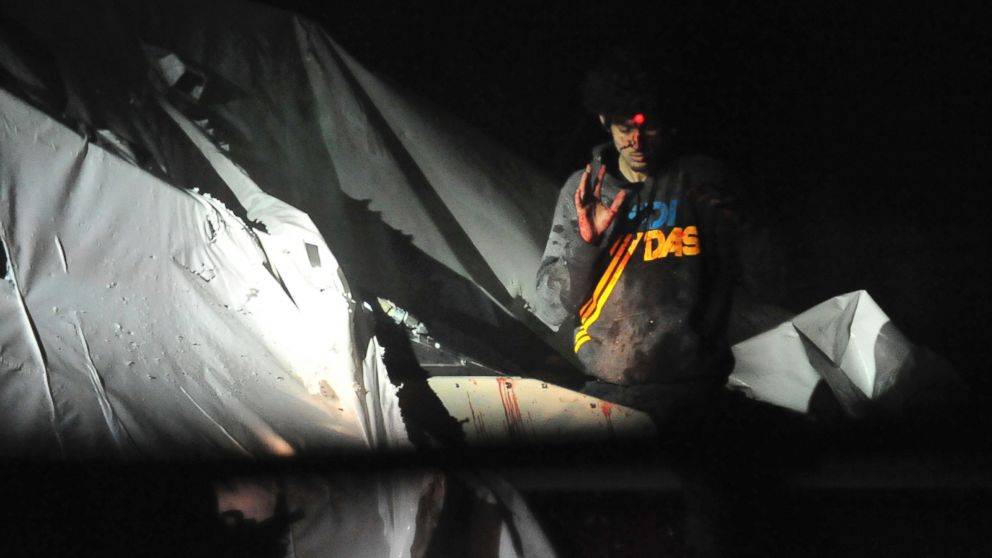 PHOTO: A sniper trains his bead on Dzhokhar Tsarnaev on April 19, 2014 him in Watertown, Mass.