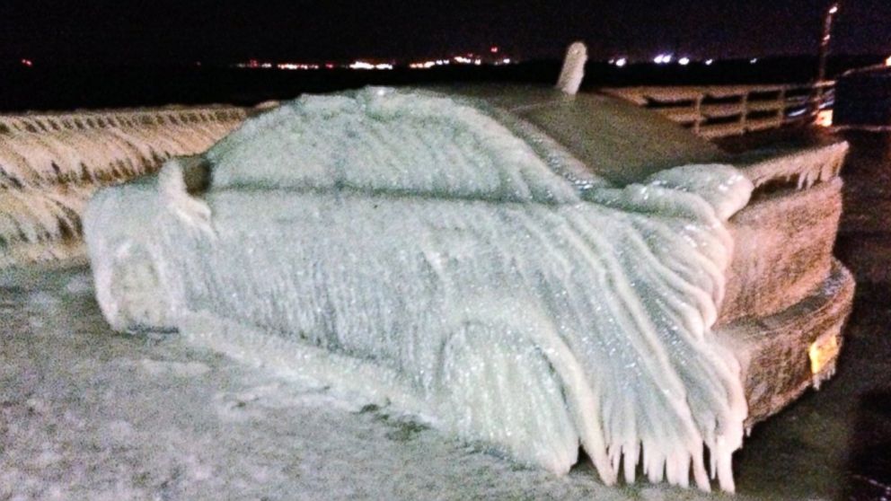 PHOTO: A car off Route 5 in Buffalo froze over from waters from Lake Eerie Sunday night and Monday morning.