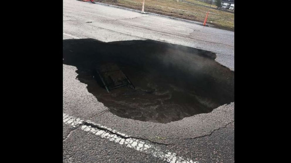 Driver escapes just before car falls into massive sinkhole - ABC News