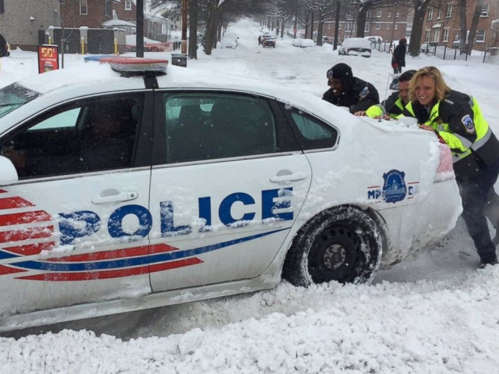 PHOTO:DC Police Department posted this image to Twitter showing fellow officers helping to free a police cruiser stuck in snow, Jan. 23, 2016.  