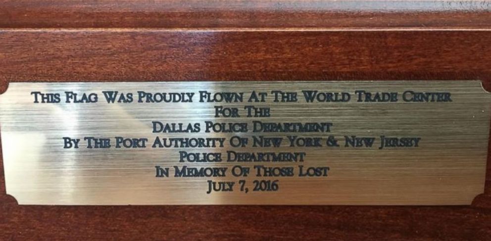 PHOTO: Dallas Police Department receives an American flag flown at the World Trade Center from New York and New Jersey police on August 2, 2016. 