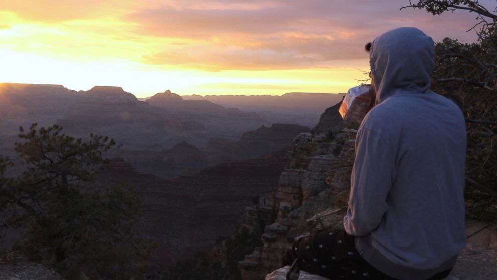 PHOTO:Daniel comfortably enjoying a sunrise at the Grand Canyon. 