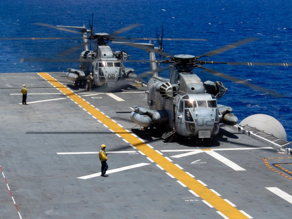 PHOTO: Two CH-53 Sea Stallions assigned to Marine Heavy Helicopter Squadron 362 idle on the flight deck of the amphibious assault ship USS Bonhomme Richard after fly-on exercises during Rim of the Pacific in 2008.
