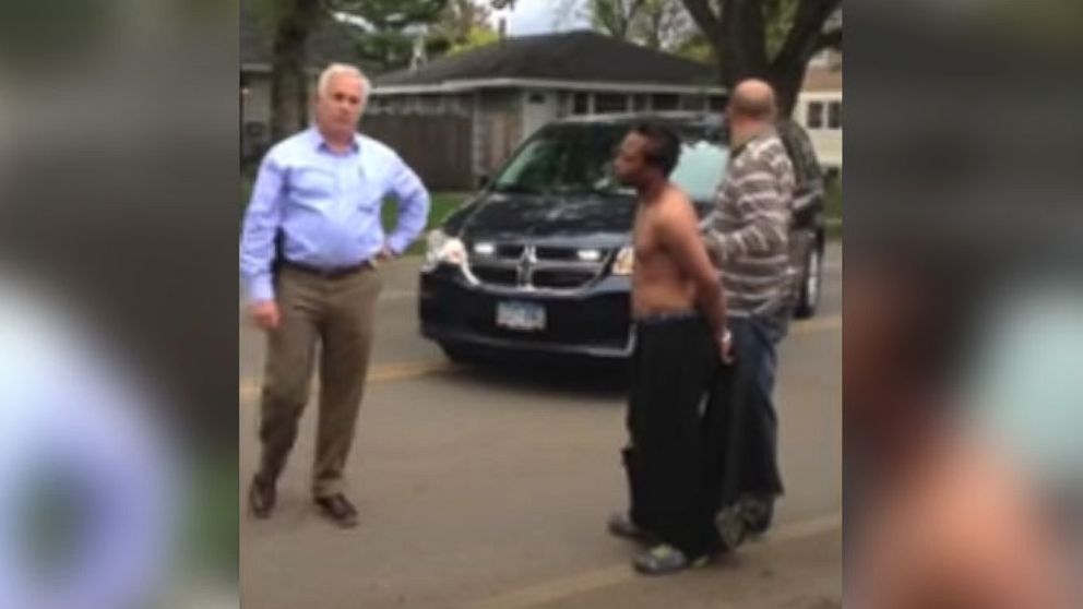 PHOTO: This image from a video that was posted on YouTube, shows a man, Larnie Thomas, being held at the arm by an Edina police officer, who refuses to let go of him.