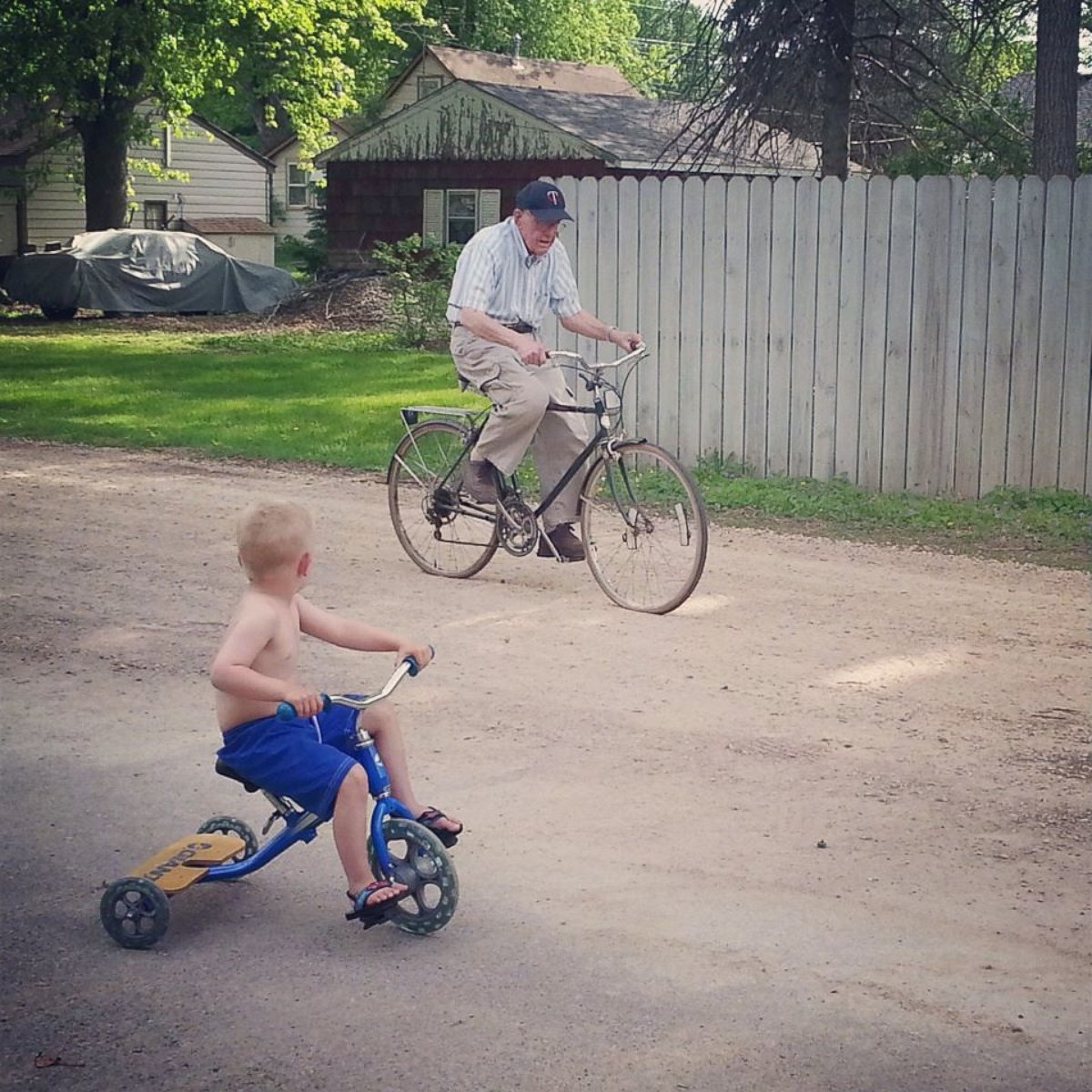 PHOTO: Emmett, left, and Erling biking together near the house.