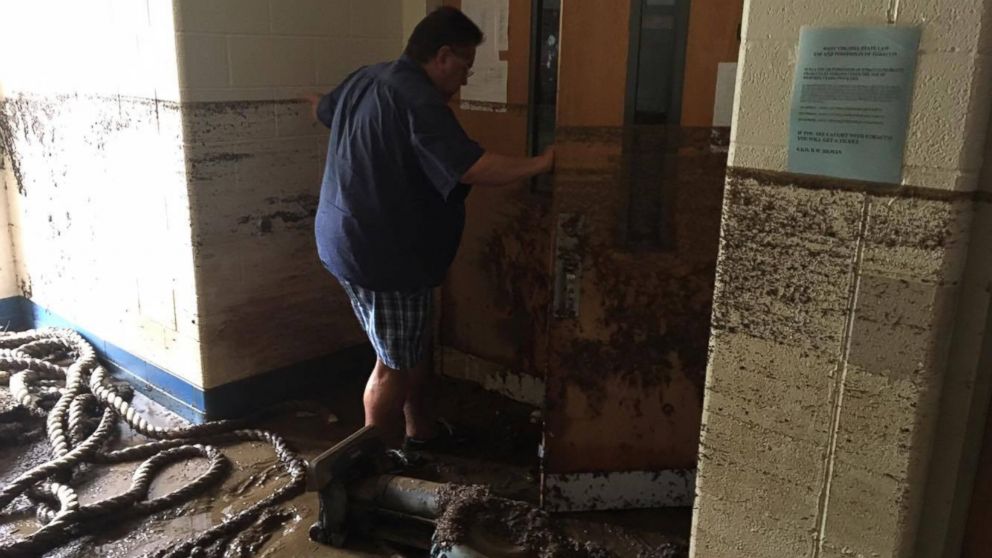 PHOTO: Photo of Greg James, Richwood High School band director, in the RHS music room. Water lines show the flooding was 4 to 5 feet.