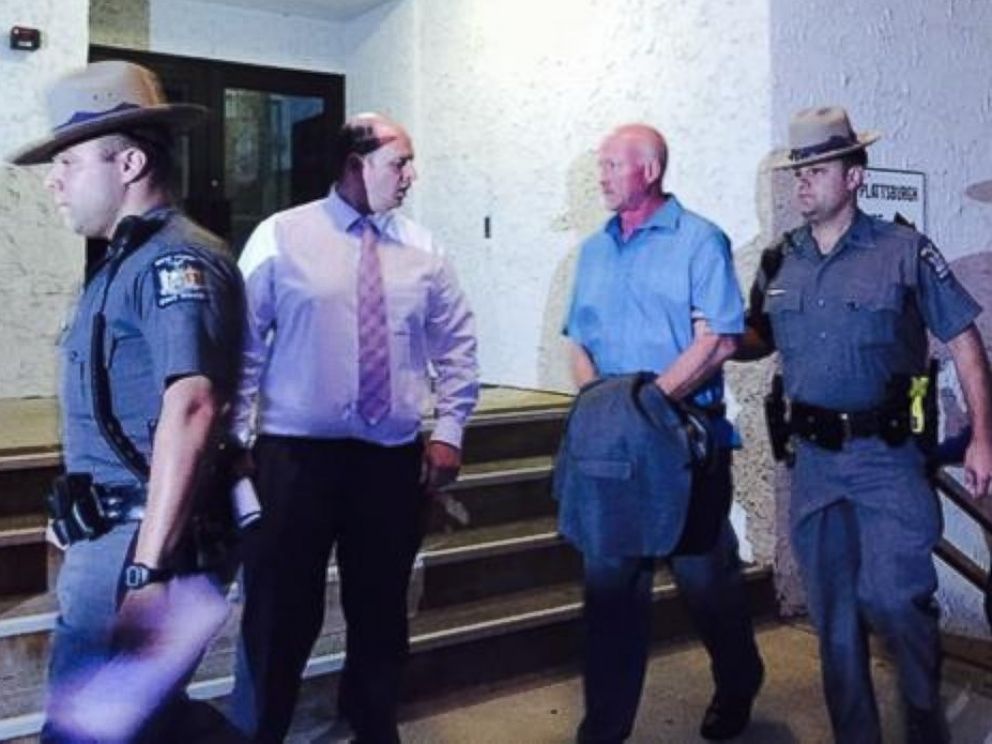 Gene Palmer, 57, an officer at the Clinton Correctional facility in Dannemora, New York, (light blue shirt) was arrested June 24, 2015, in connection with the escape of two convicted murderers who have evaded capture for weeks.