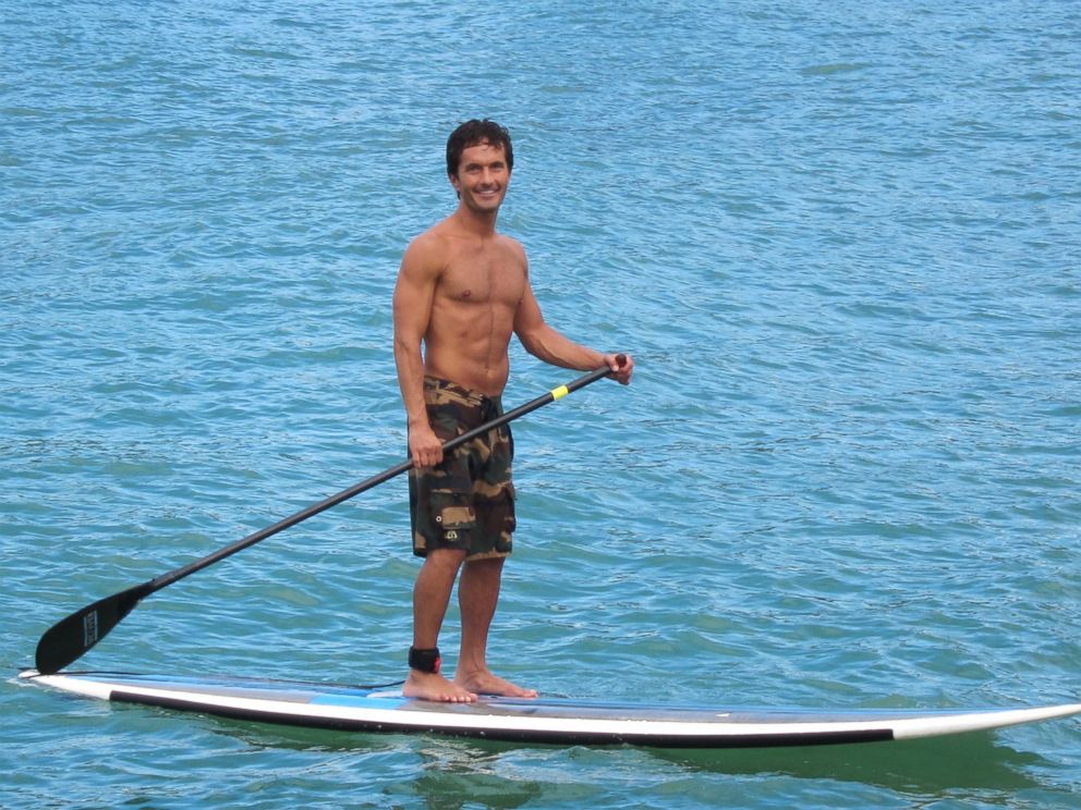 Khalil Rafati is shown here paddle-boarding in Kauai, Hawaii.