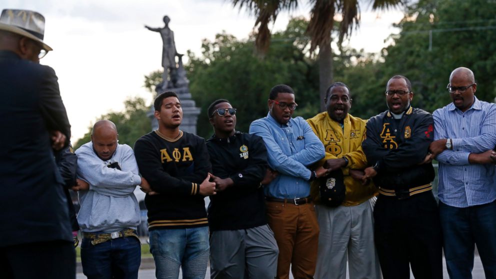PHOTO: Graduate members of Alpha Phi Alpha Fraternity pray during a "social action prayer vigil" across the street from the Jefferson Davis monument in New Orleans, Thursday, May 4, 2017.