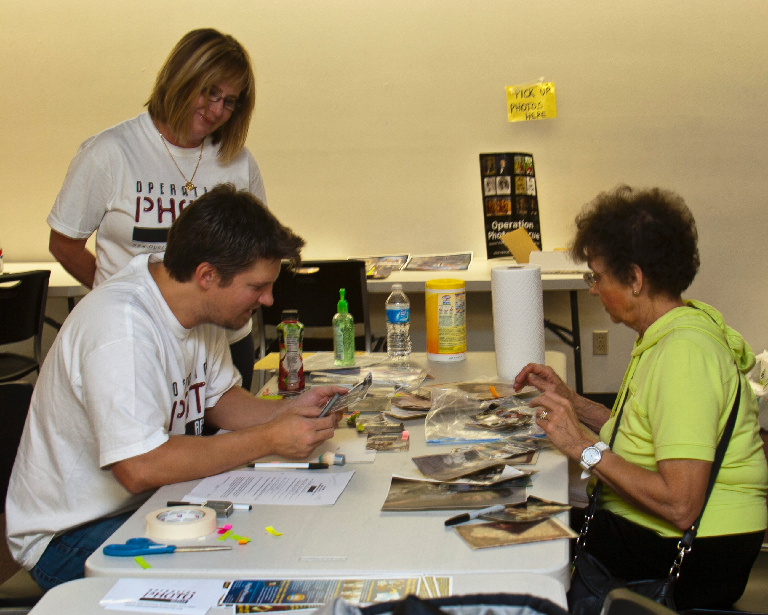 PHOTO: Operation Photo Rescue volunteers work at the public library to help families in the aftermath of the Joplin, Missouri tornado that hit in Oct. 2011.