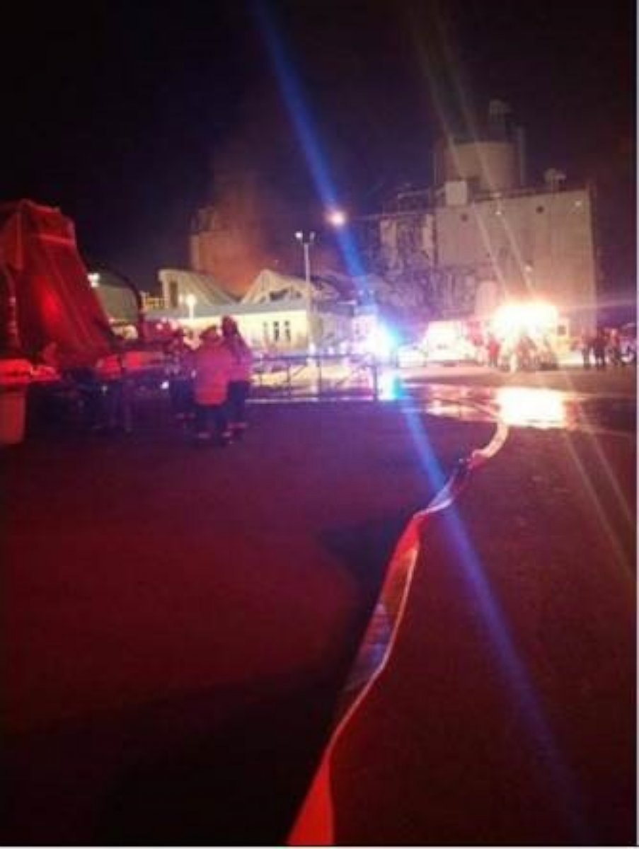 Emergency officials respond to an explosion at the Didion Milling plant in Cambria, Wisconsin. 