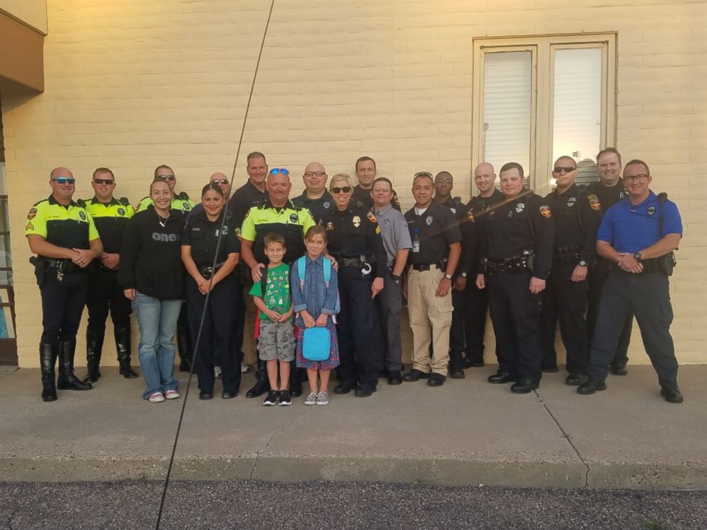PHOTO: Nearly two dozen police officers from the Amarillo Police Department in Texas surprised and escorted a fallen comrade's children on their first day of school on Aug. 22, 2016.