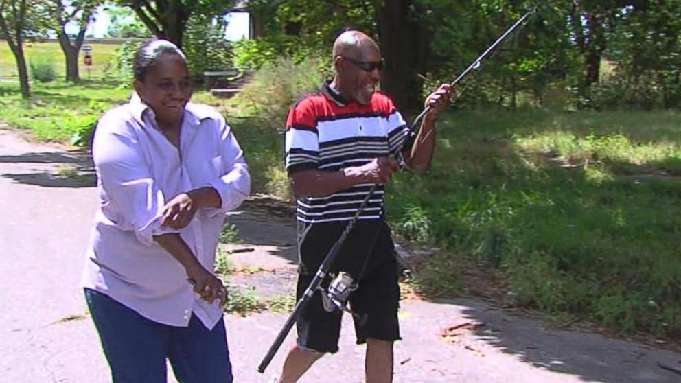 PHOTO: Residents turn a sinkhole into a fishing hole on Hull Street and McNichols in Detroit, Mich. on Aug. 24, 2015.