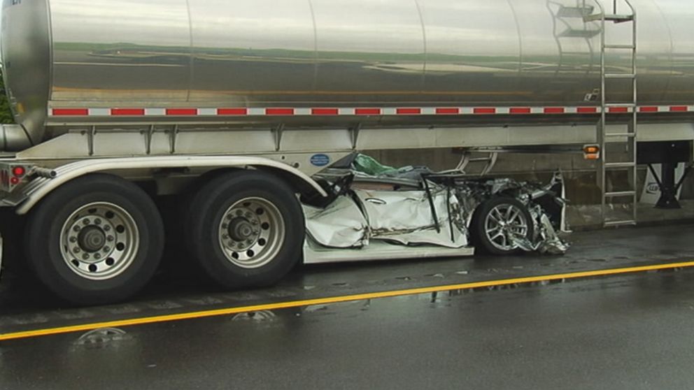 A car collided with a milk tanker, wedging the car underneath, in Mt. Juliet, Tenn., on July 2, 2015.