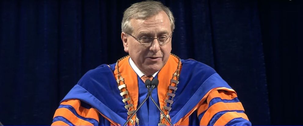 PHOTO: University of Florida President Kent Fuchs addresses students at one of the school's Spring 2018 commencement ceremonies. 