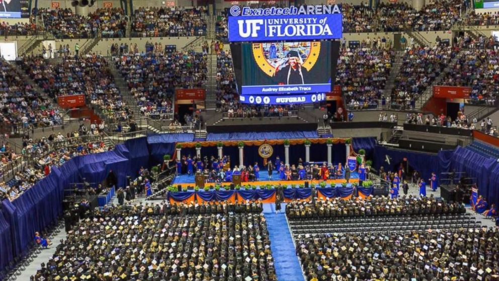 Dancing college grads dragged off stage, school apologizes for being