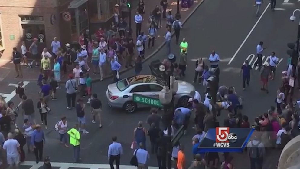 PHOTO: A group of Good Samaritans rescued three people trapped under a car after they were run over on a crosswalk in Boston, Massachusetts, Aug. 18, 2016, according to the Boston Police Department. 