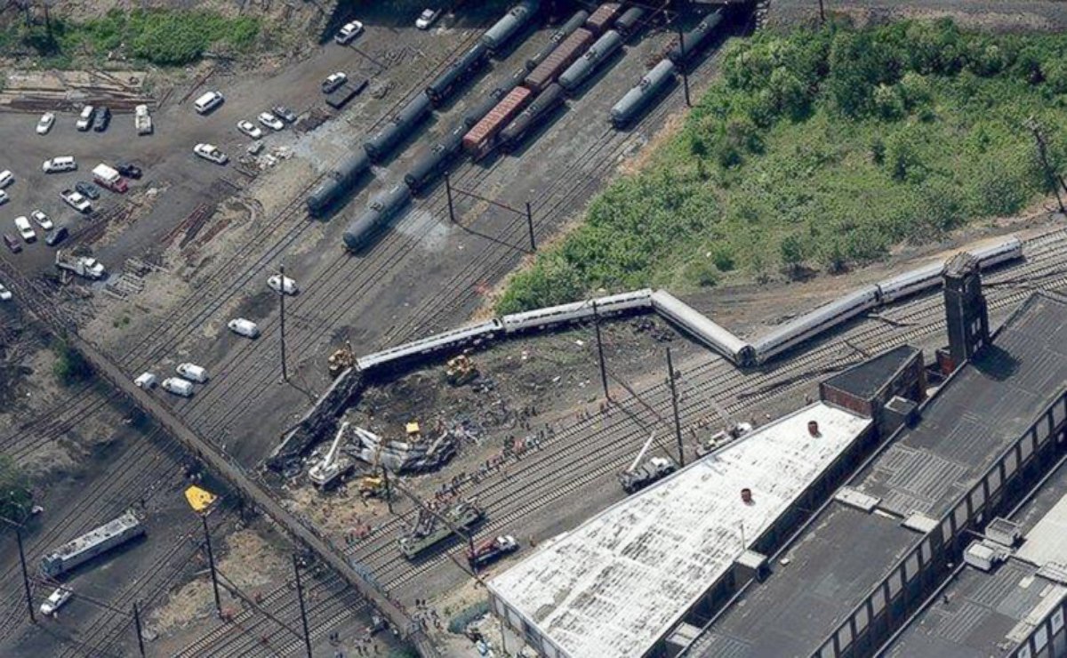 PHOTO: Two Amtrak passenger cars are seen on their sides, with the remains of a damaged passenger car, May 12, 2015, outside Philadelphia.