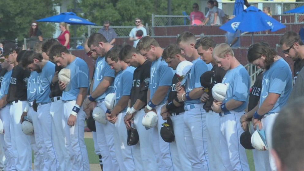 PHOTO:The Liberal Bee Jays pay tribute to their batboy, Kaiser Carlile, in Wichita, Kan. 