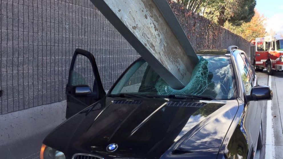 PHOTO: The driver of a BMW escaped with only a scratch on his arm when a large object crashed through the windshield. 