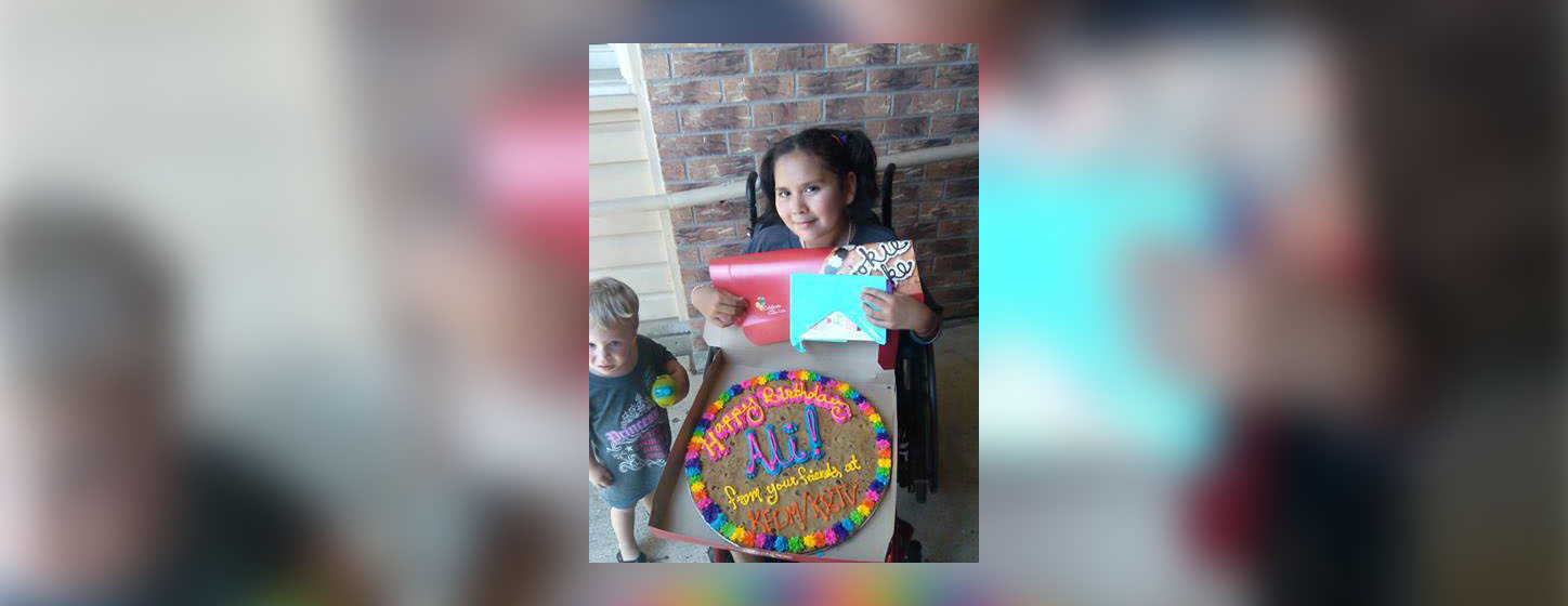 PHOTO: Ali poses with a birthday cookie cake given to her by the staff at the local news station that interviewed her, Aug. 6, 2014.