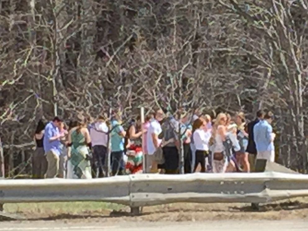 PHOTO: A crowd gathers at the scene of a bus fire in Sturbridge, Massachusetts, April 18, 2015.