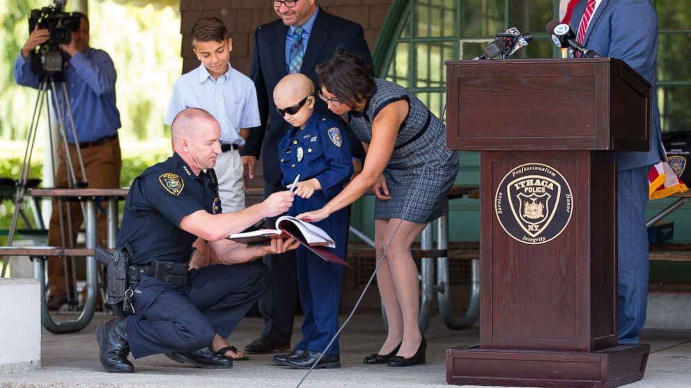 PHOTO: Colin Hayward Toland, 9, was sworn into the Ithaca Police Department Monday while surrounded by his family, friends and fellow officers. 