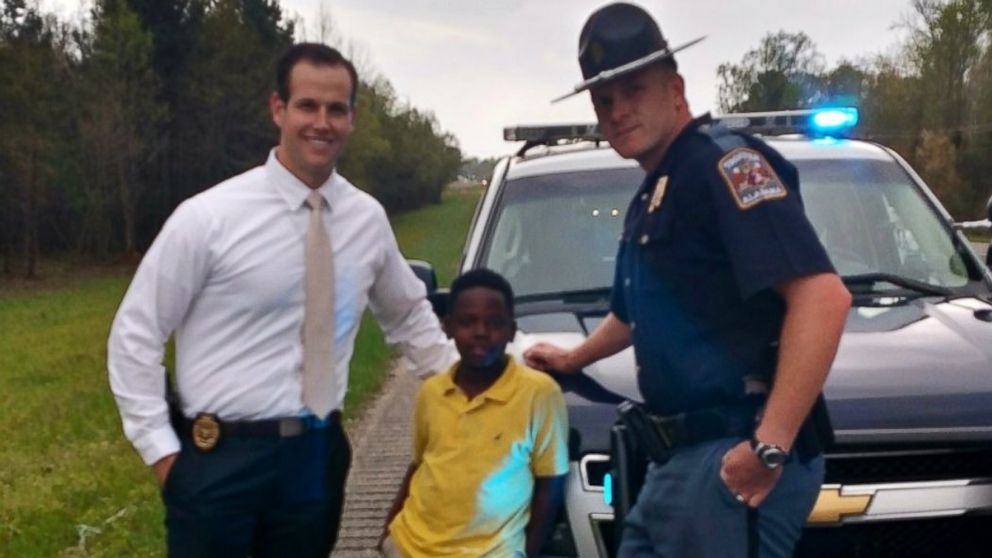 Christopher Wheeler, 10, with Agent Eric Salvador and Trooper Lee Walls. 