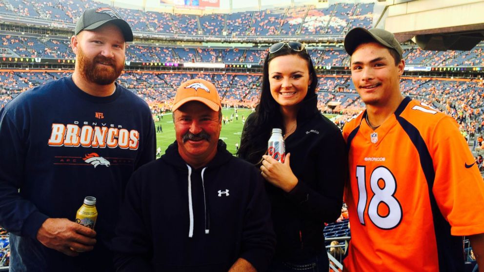 Paul Kitterman, second from left, poses for a photo with his stepson, Jarod Tonneson, left, and two family friends shortly before his disappearance at a Denver Broncos game on Oct. 23, 2014.