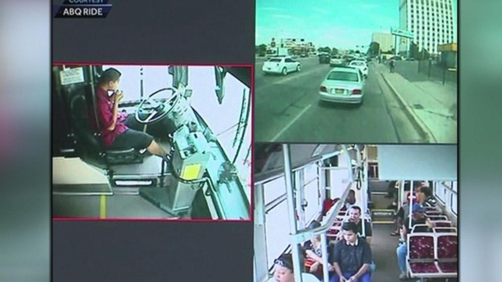 PHOTO: A bus driver is seen eating a burrito with both hands off the wheel just before the bus crashed, July 28, 2014 in Albuqueque, N.M.