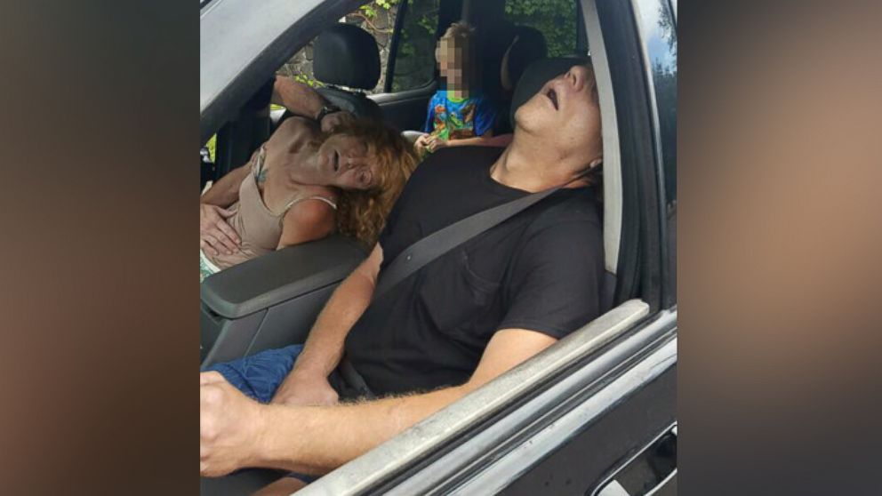 The East Liverpool Police Department in Ohio released a photo showing a child in the back seat of a car while the driver and other passenger allegedly overdosed on heroin.