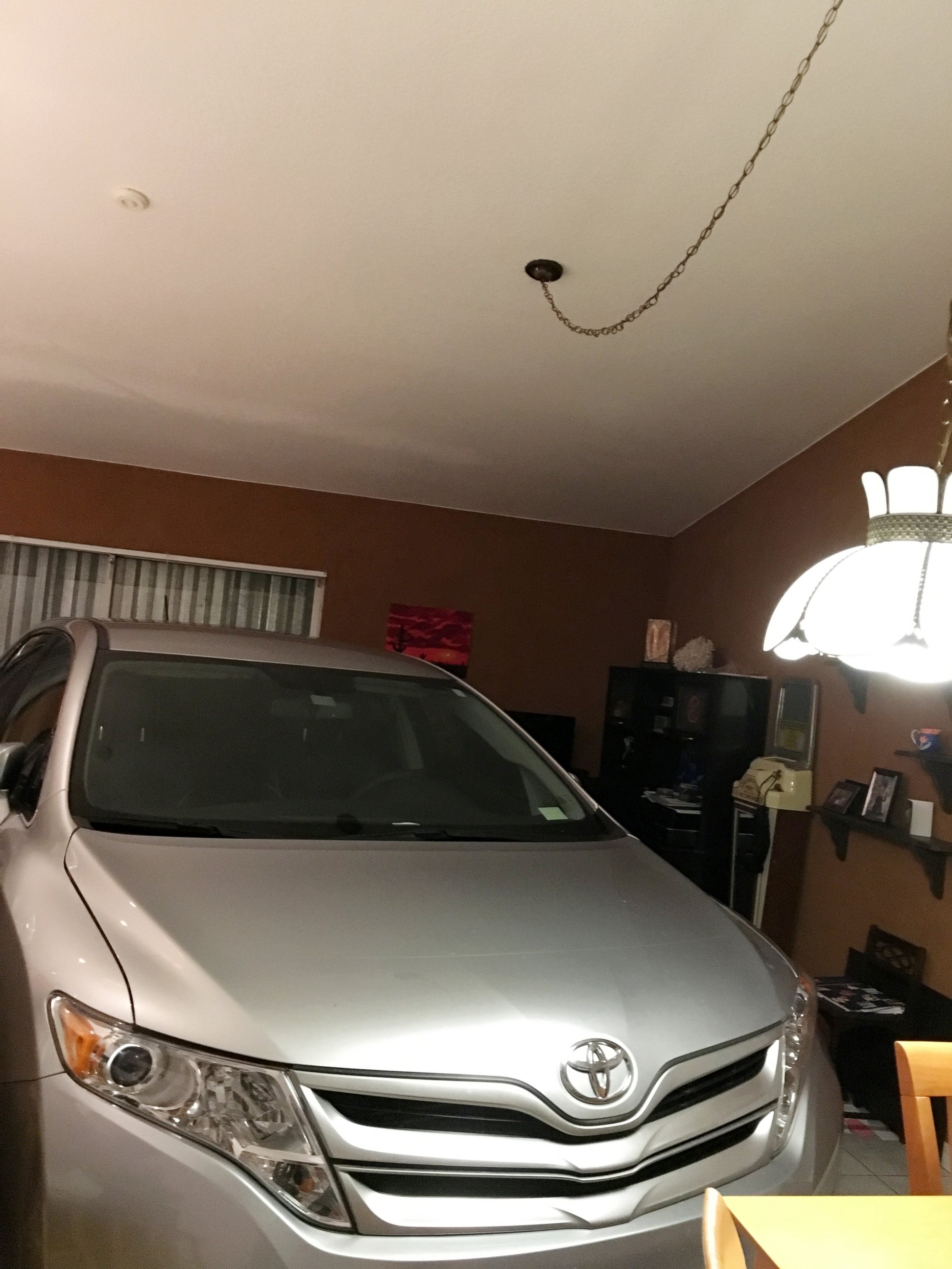 PHOTO: Miami resident Adriana wanted to protect her car from Hurricane Matthew as it approached Florida's coast. But with no room in his one-car garage, Adriana's fiance decided to put her car in the living room, Oct. 6, 2016.