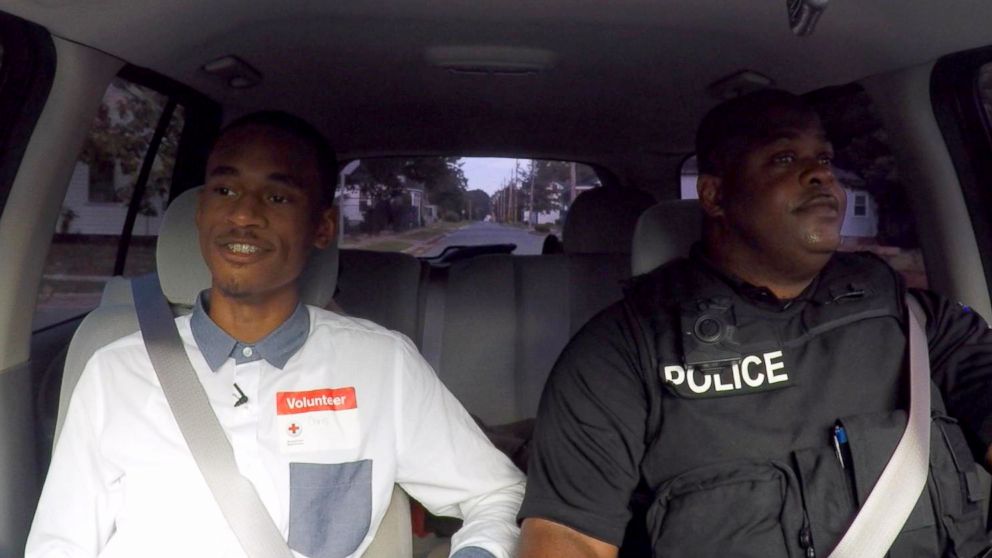PHOTO: Chris Suggs rides with Sgt. Dennis Taylor of the Kinston Police Department.