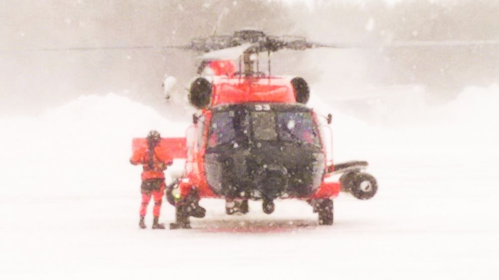 PHOTO: A Coast Guard Air Station Cape Cod helicopter crew returns from rescuing a father and son from a sailboat about 150 miles south of Nantucket, Mass., Feb. 15, 2015. 