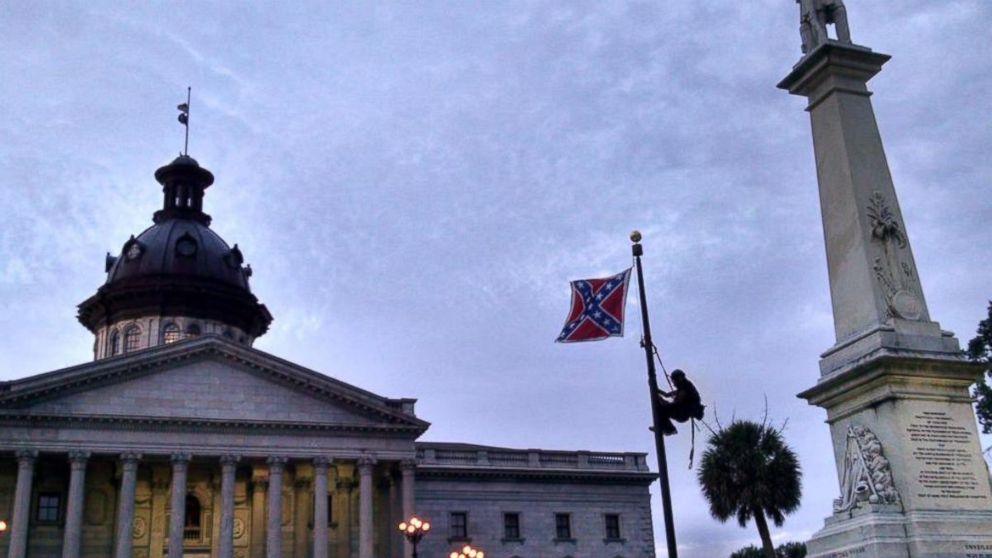 PHOTO: A woman climbed the flag pole in front of the South Carolina Statehouse and removed the Confederate flag.