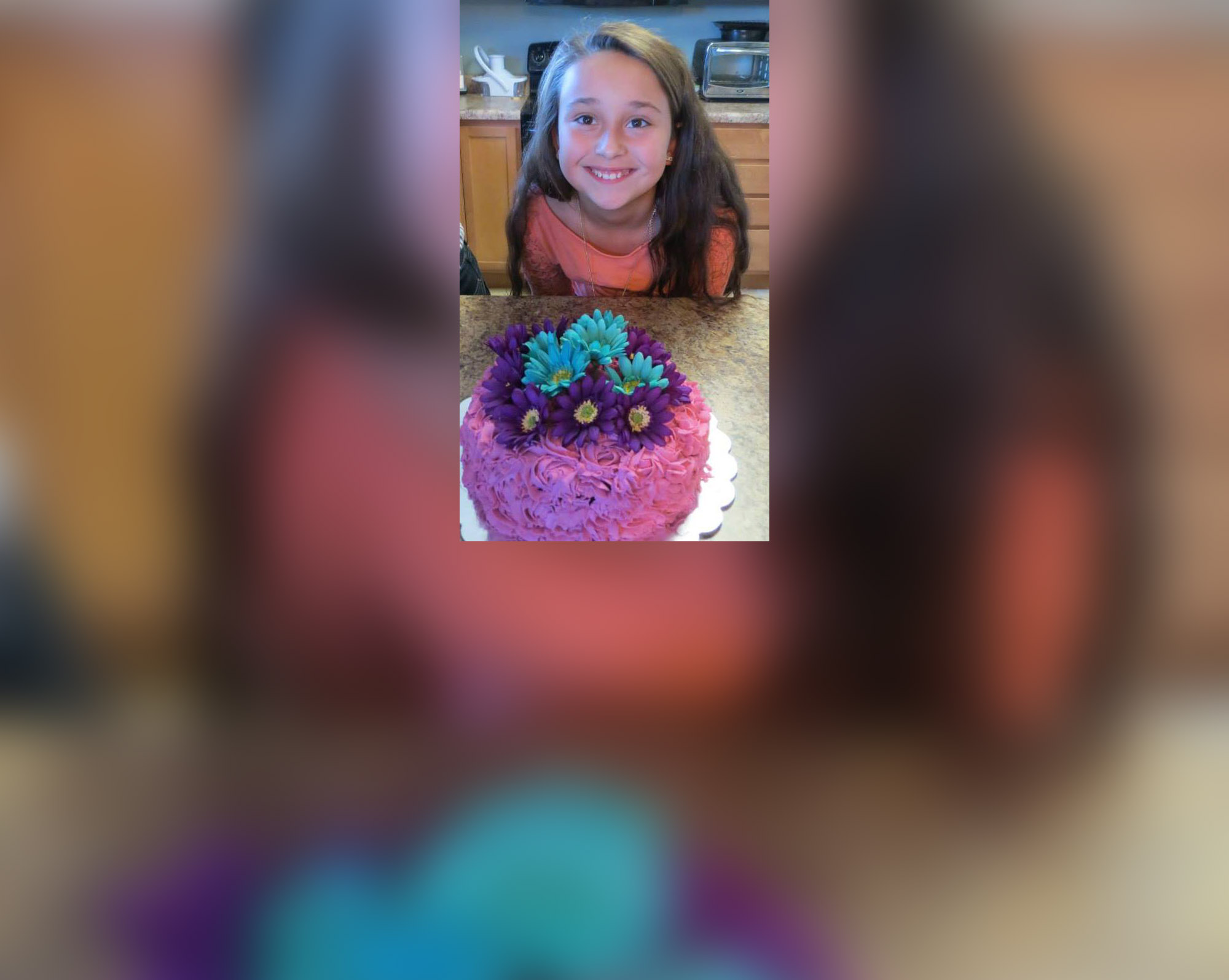 PHOTO: Chloe Stirling smiles for a photo with a cake she made.